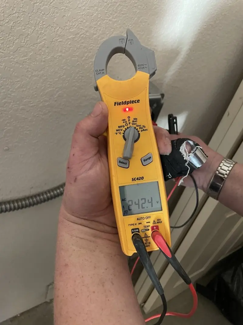 Voltage testing with clamp meter during Whole House Surge Protector in McKees Rocks